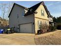 Two-story home with stone accents, siding, and an attached garage at 150 Bellemeade Ct, Fayetteville, GA 30215