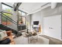 Contemporary living room with a sleek console, stylish decor, and large windows providing natural light and views at 307 Cherokee Se Ave # 9, Atlanta, GA 30312