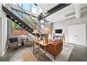 Bright living room with modern furnishings, sleek staircase, and large windows offering ample natural light at 307 Cherokee Se Ave # 9, Atlanta, GA 30312