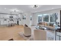 Open-concept living room flowing into a modern, all-white kitchen at 2254 Glendale Drive, Decatur, GA 30032