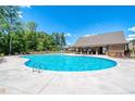 View of the community swimming pool with ample space for lounging; near the community clubhouse at 3194 Ivy Farm Path, Buford, GA 30519