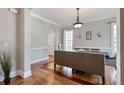 Bright dining room featuring wainscoting, hardwood floors and natural light at 1459 Hedgewood Nw Ln, Kennesaw, GA 30152