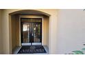 Condo building entrance with double doors, welcoming mat, and classic architecture at 222 Ashford Cir # 222, Atlanta, GA 30338