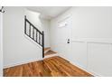 Bright foyer with hardwood floors, staircase, and a paneled door allowing natural light at 3182 Glynn Mill Dr, Snellville, GA 30039