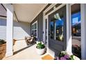 Cozy front porch with rocking chairs, stylish door, and pleasant outdoor decor at 17 Baral Rdg, Sharpsburg, GA 30277