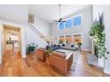 Spacious living room with high ceilings, fireplace, and large windows offering ample natural light at 17 Baral Rdg, Sharpsburg, GA 30277