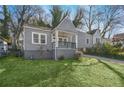 Charming home with a cozy front porch and well-maintained lawn at 2006 Conrad Se Ave, Atlanta, GA 30315