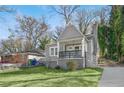 Charming home with a cozy front porch and well-maintained lawn at 2006 Conrad Se Ave, Atlanta, GA 30315