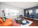 Cozy living room with a modern accent wall and contemporary furnishings at 1073 Oakland Drive Sw Dr, Atlanta, GA 30310