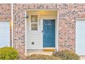 Close-up of front door featuring blue color, house number, and welcoming entrance at 6356 Kennonbriar Ct, Lithonia, GA 30058