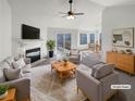 Staged living room with a fireplace, neutral furniture, and an open floor plan at 1831 Killarney Sw Dr, Marietta, GA 30008