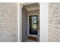 Close up of the front door entryway with brick and siding at 3037 Ferrington Way, Smyrna, GA 30080