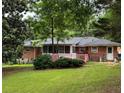 A fenced backyard offering a pink deck and beautiful green grass at 4188 Fontana Ct, Tucker, GA 30084