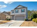 Attractive two-story home with a gray exterior and a convenient two-car garage at 110 Centennial Ridge Dr, Acworth, GA 30102
