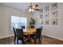 Bright dining room featuring a round table, dark chairs, and a decorative gallery wall at 845 Johnson Mill Ter, Sugar Hill, GA 30518