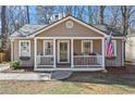 Inviting exterior of a single-story home with a quaint front porch at 144 Murray Hill Ne Ave, Atlanta, GA 30317