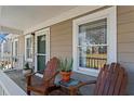 Relaxing front porch featuring wooden chairs and plants at 144 Murray Hill Ne Ave, Atlanta, GA 30317