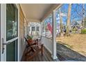 Cozy front porch with chairs, offering a comfortable outdoor space at 144 Murray Hill Ne Ave, Atlanta, GA 30317