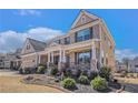 Beautiful home featuring manicured landscaping, covered porch and a two car garage at 2435 Portsmouth Ct, Marietta, GA 30064