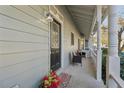 Inviting front porch featuring outdoor seating and a decorative front door at 4035 Chelsea Cmn, Tucker, GA 30084