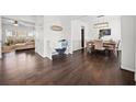 Open-concept living and dining area with hardwood floors and abundant natural light at 113 Plumeria St, Canton, GA 30114