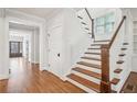 Hallway with hardwood floors, natural light, and staircase to the second floor at 970 Drewry Ne St, Atlanta, GA 30306