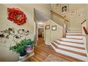 Inviting entryway featuring hardwood floors, staircase, and decorative wall art at 1267 Huntington Place Cir, Lithonia, GA 30058