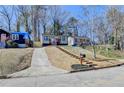 Neighborhood street view of home with a sidewalk and grassy lawn at 2767 3Rd Sw Ave, Atlanta, GA 30315