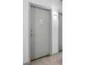 Apartment door with visible unit number and modern design, set in a neutral-toned hallway at 115 W Peachtree Nw Pl # 602, Atlanta, GA 30313