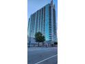 A full exterior view of a modern high-rise building featuring multiple stories and balcony views at 361 17Th Nw St # 1610, Atlanta, GA 30363