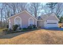 Charming single-story home featuring a two-car garage and well-manicured front yard at 403 Flint Hill Ct, Lawrenceville, GA 30044