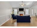 A charming living room featuring a fireplace and hardwood floors at 3540 Traddsprings Way, Snellville, GA 30039