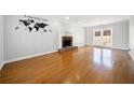 Inviting living room featuring a fireplace, hardwood floors, and ample natural light at 4358 Stockton Way, Marietta, GA 30066