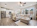 Bright living room with hardwood floors, neutral decor, and large windows allowing ample natural light at 126 Maple Creek Way, Woodstock, GA 30188
