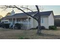 Cozy house with a inviting front porch and charming details enhancing its curb appeal at 3129 Rock Pine Way, Snellville, GA 30078