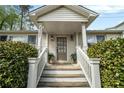 Charming front entrance with white pillars, brick accents, and well-maintained landscaping at 2107 Old Dallas Sw Rd, Marietta, GA 30064