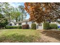 Charming ranch home with brick exterior, mature trees and a well-manicured lawn at 2107 Old Dallas Sw Rd, Marietta, GA 30064