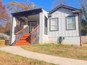 Attractive house with orange steps, modern railings, painted brick, and nice curb appeal at 1074 Hobson Sw St, Atlanta, GA 30310