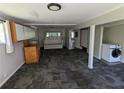 Spacious living room with neutral carpeting, a washer, and storage cabinets at 3941 Covered Bridge Sw Rd, Smyrna, GA 30082