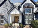 Inviting front porch featuring stylish decor and a welcoming entrance at 110 Roberts Rd, Suwanee, GA 30024