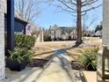 View from the porch showcasing the landscaped front yard and neighboring homes at 110 Roberts Rd, Suwanee, GA 30024