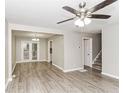 Inviting living space with modern floors and seamless transition to a dining area at 3390 Navaho Se Trl, Smyrna, GA 30080