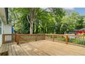 A spacious wooden deck perfect for entertaining with views of the private backyard at 1551 Avon Ave, Atlanta, GA 30311