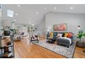 Bright living room with vaulted ceilings, hardwood floors, and a comfortable seating area at 1551 Avon Ave, Atlanta, GA 30311