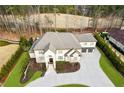 Expansive property showcasing a sprawling home, manicured lawns, and a long, winding driveway at 4434 Oglethorpe Nw Loop, Acworth, GA 30101