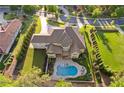 Sprawling backyard featuring a private pool, patio area, and meticulously manicured lawn at 4434 Oglethorpe Nw Loop, Acworth, GA 30101