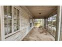 Covered porch featuring weathered wood and screens at 1687 Neely Ave, Atlanta, GA 30344