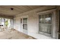 View of the covered porch, showing a weathered ceiling and walls at 1687 Neely Ave, Atlanta, GA 30344