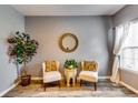 Charming living room showcases neutral walls, stylish decor, and a cozy seating arrangement with ample natural light at 7750 Carnegie Dr, Fairburn, GA 30213