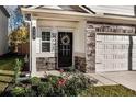 Inviting front door with wreath, decorative stone accents, and a well-maintained landscaped entrance at 158 Bryon Ln Ln, Acworth, GA 30102